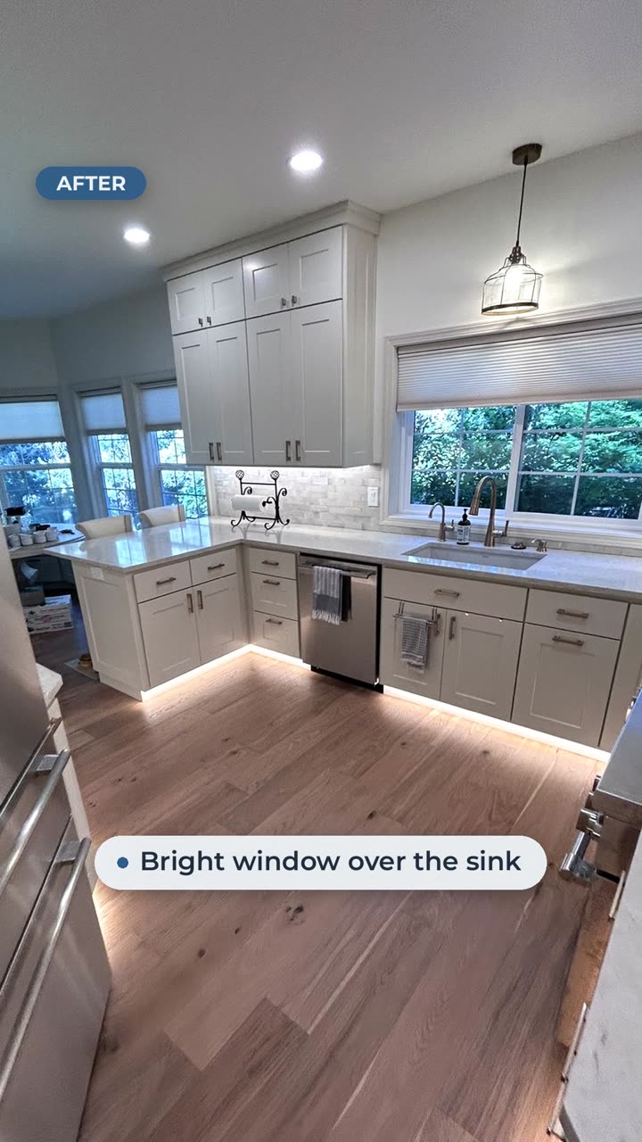 After: remodeled kitchen with light gray shaker cabinets and under-cabinet lighting